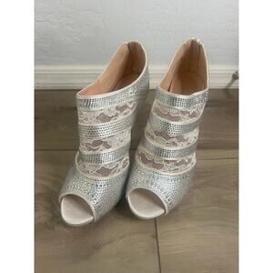 Women’s lace and rhinestone peep toe heels